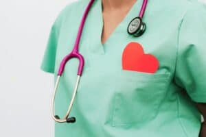 Doctor wearing medical robes with heart in the pocket
