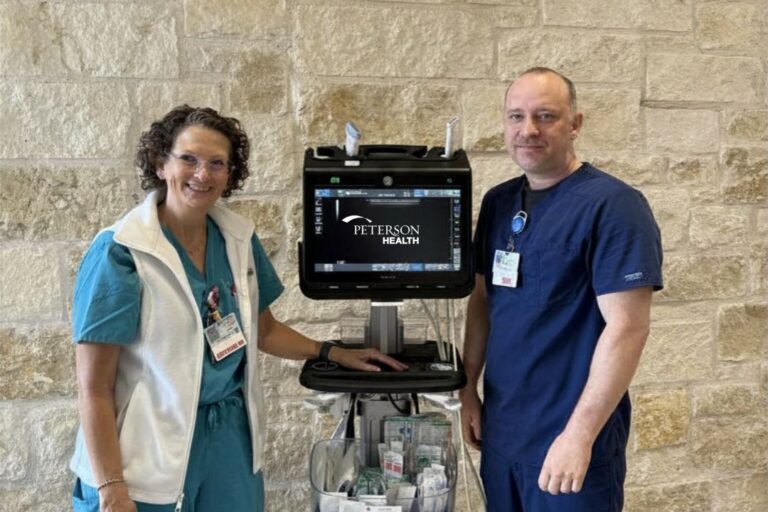 Healthcare professionals with medical equipment at Peterson Health facility.