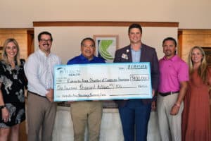 Peterson Health representatives present a $100,000 donation check to Kerrville Chamber of Commerce.